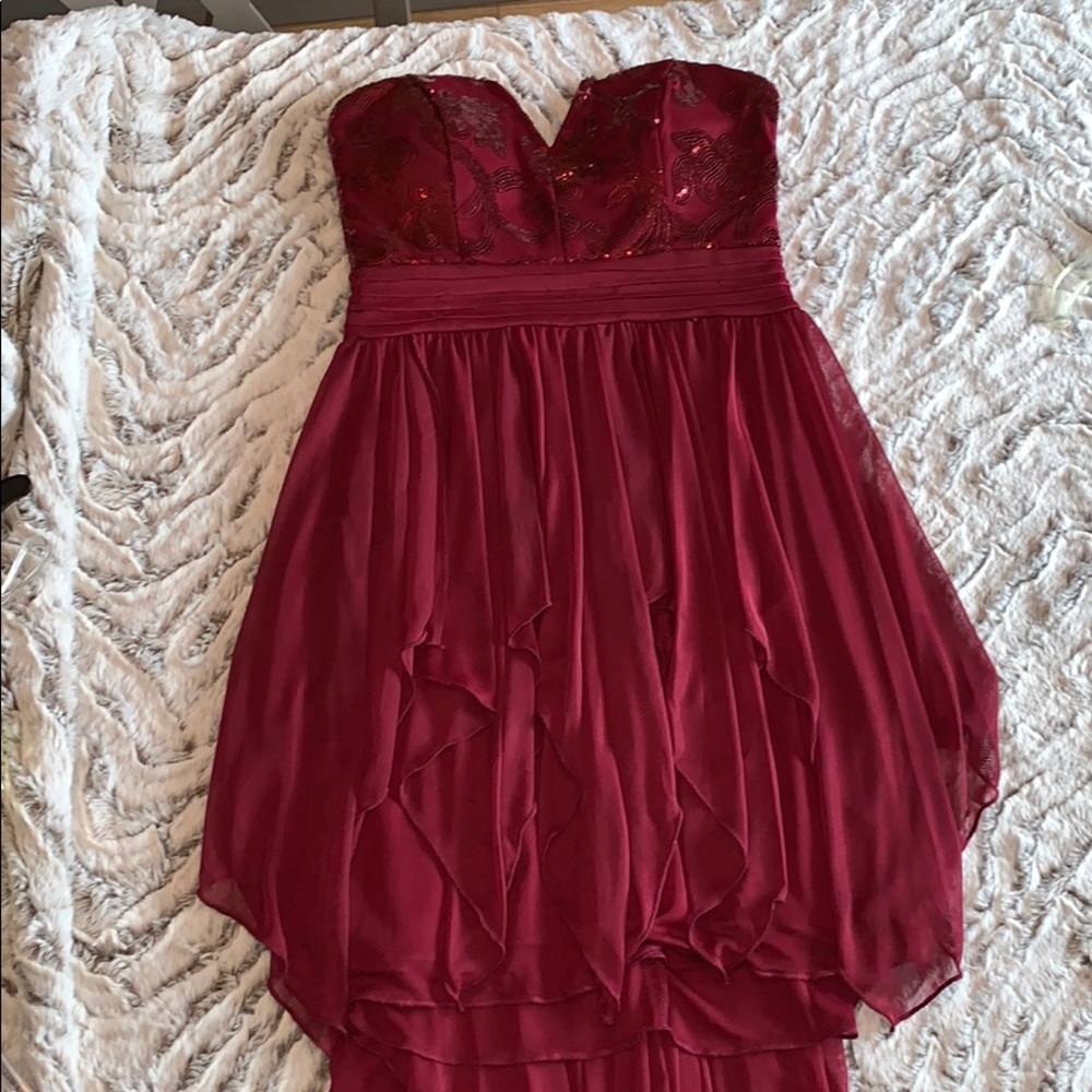 Burgundy sequined high low strapless dress